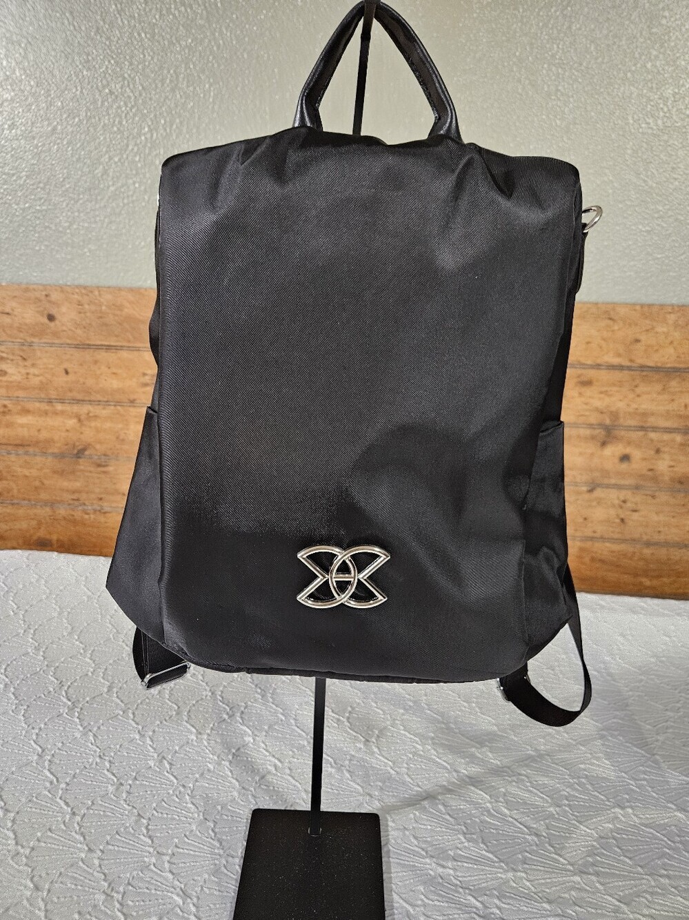 Amazon Women's Black Nylon Anti-theft Backpack with Silver Emblem